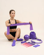 Woman using the Numan Pilates resistance band
